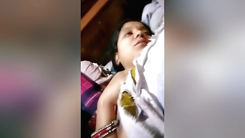 Busty brunette babe with big tits makes a solo video