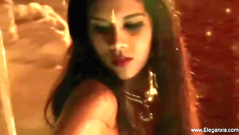 Indian brunette seduces the camera and enjoys being filmed