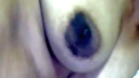 Black boots with a black ring on her butt and her hands on cock