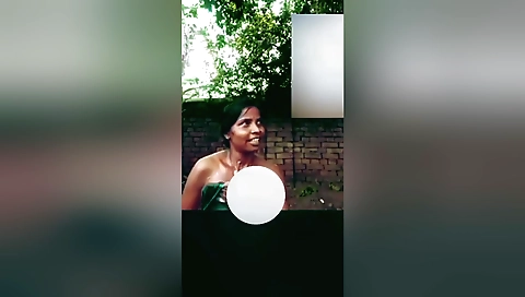 Indian girl loves the rain outside and makes an amateur solo video