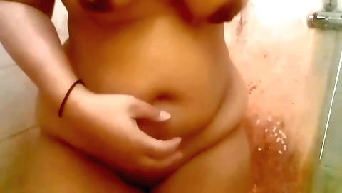 Busty girl enjoys taking a shower while in a hot mood