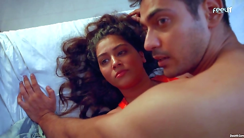 Bright brunette dancing with a white dress in a video