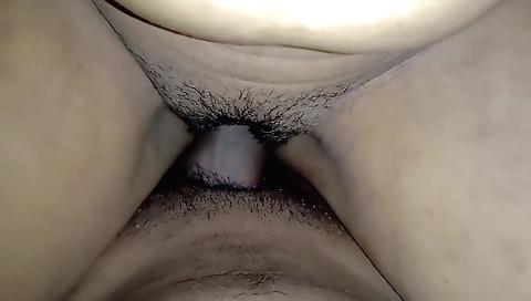 Busty indian woman in a sexy black skirt and red shirt