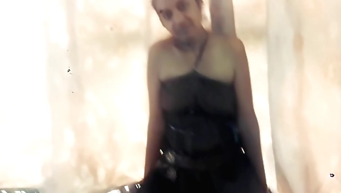 Indian woman is at her door preparing for the party