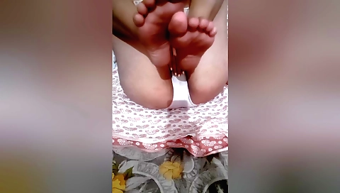 Indian brunette seduces and masturbates a man with her foot