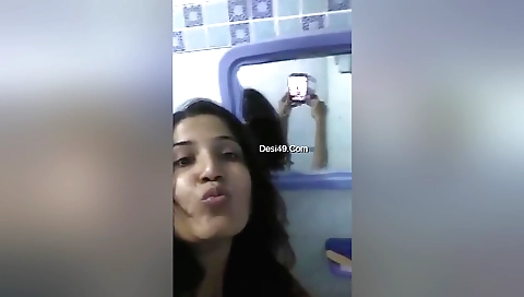 Indian hottie in her bath room in her white bikini