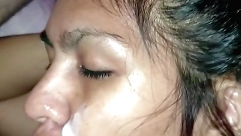 Brunette with natural boobs sucking and cumming on her face