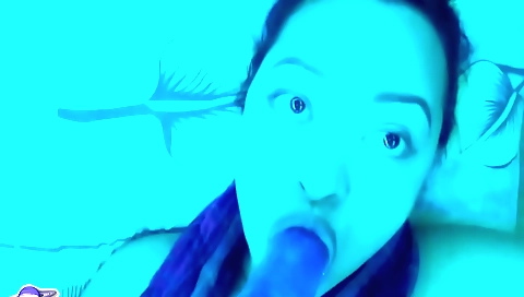 Slutty brunette with a shaved pussy is playing with a toy