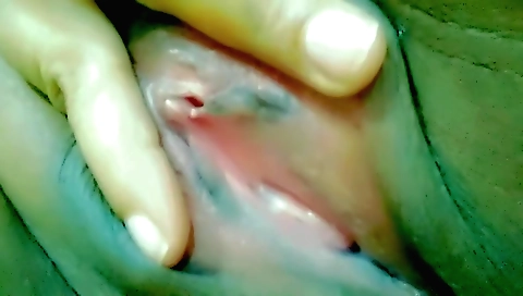 Indian chick masturbates with her fingers on the couch