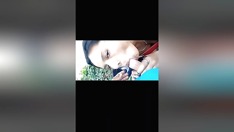 Indian chick is getting filmed on the beach by the camera